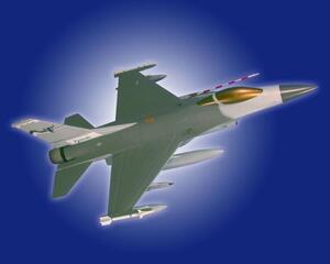 F-16 scale model banking against a blue backdrop, showing its gold-tinted canopy, gray fuselage and underwing stores