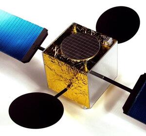 GPS satellite scale model at an angle, showing gold foil body, blue solar panels on booms and two black round dishes
