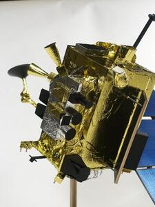 LRO satellite model in gold Mylar, close view of the instrument side with black sensor cylinders and silver foil