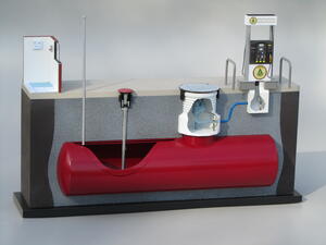 Underground storage tank cutaway model with red tank, tank sump, fill pipe, vent pipe and fuel dispenser on black base