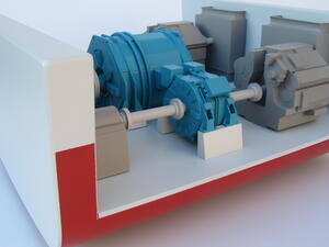 Ship propulsion model close-up of blue electric motors on drive shafts inside a red and white hull slice