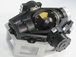 Gyroscope model on silver hexagonal stand, angled view of black gimbal frame with gold rotor and bolted motor housings