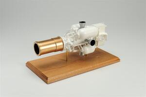 EKV model on an oak display base, three-quarter view of the gold sensor tube, white fuel tanks and thrusters