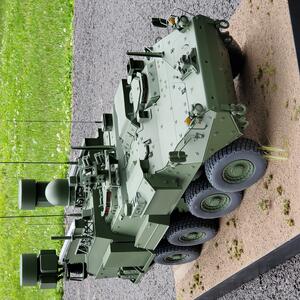 Stryker laser system model seen from above the front right, showing sensor masts, dome and launcher on the roof