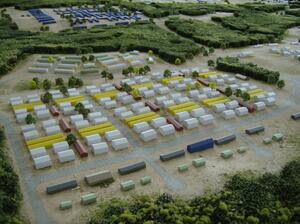 Military base model close-up of rows of white, yellow and red barracks buildings between gray roads and trees