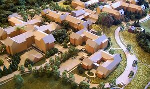 Residential massing model seen from above, with block buildings, tree-lined parking and a curving path on the right