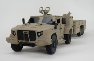 1/12 scale JLTV model with trailer, front three-quarter view showing grille, headlights and roof gun mount
