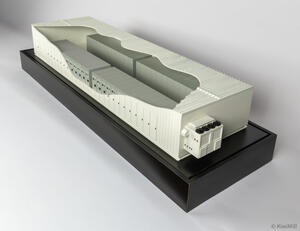 E-House scale model for Mission Critical Group with sculpted roof cutaway revealing equipment rows and end HVAC unit