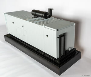 Generator enclosure scale model for Mission Critical Group, elevated three-quarter view with roof muffler and black base