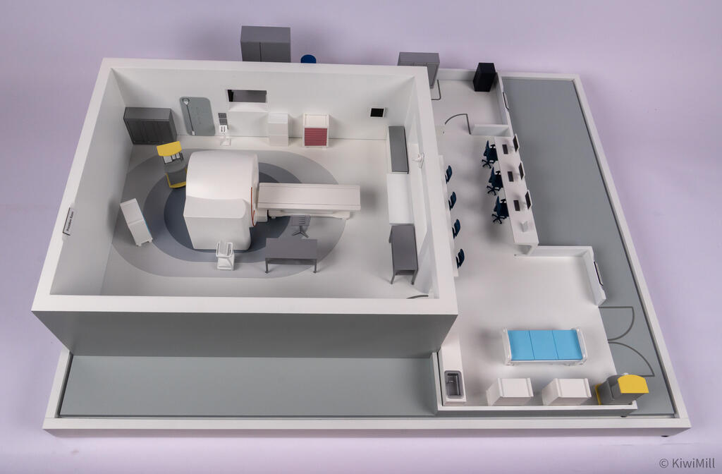 Overhead view of the full MRI suite layout on its base, with procedure room, control room and induction room