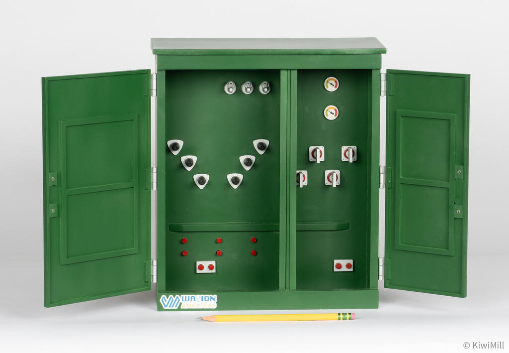 Straight-on view of open transformer cabinet with high-voltage and low-voltage compartments divided down the middle