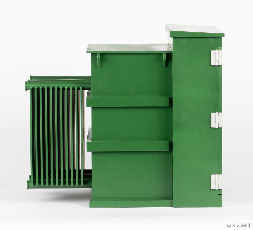 Side profile of pad-mounted transformer model with radiator fins at the rear, ribbed tank and hinged cabinet