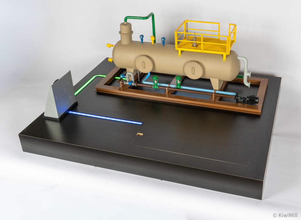 Separator skid model three-quarter view from the right, showing control valves, pump and motor, and blue light path
