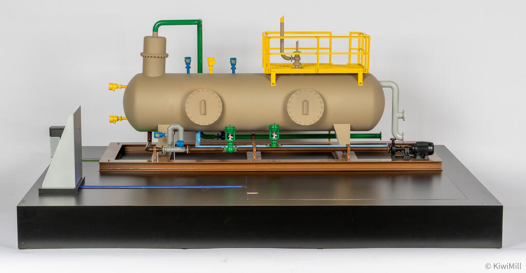 Separator skid scale model front view, horizontal vessel with yellow platform on brown frame atop a black display base