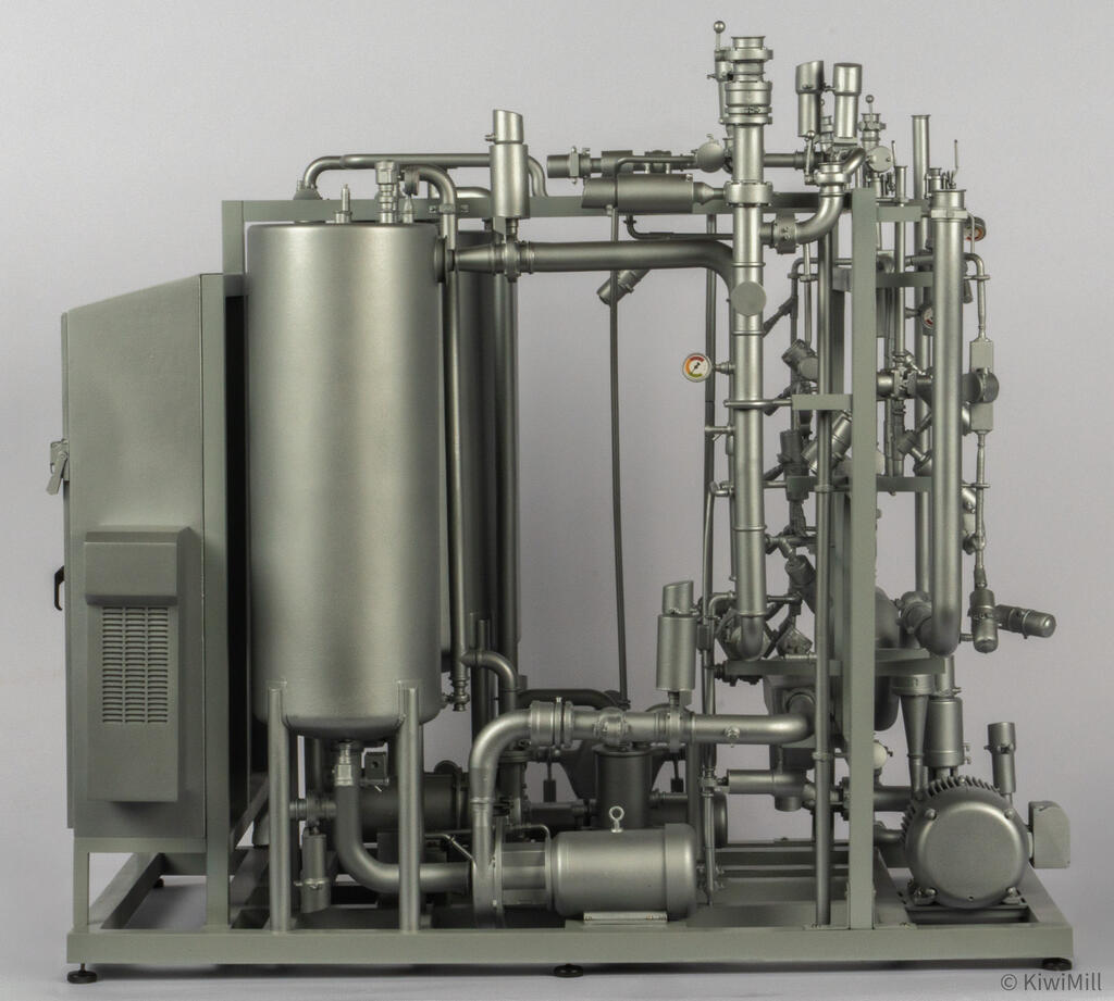 Straight rear elevation of the blending skid with louvered panel, legged tank and frame of valves and gauges