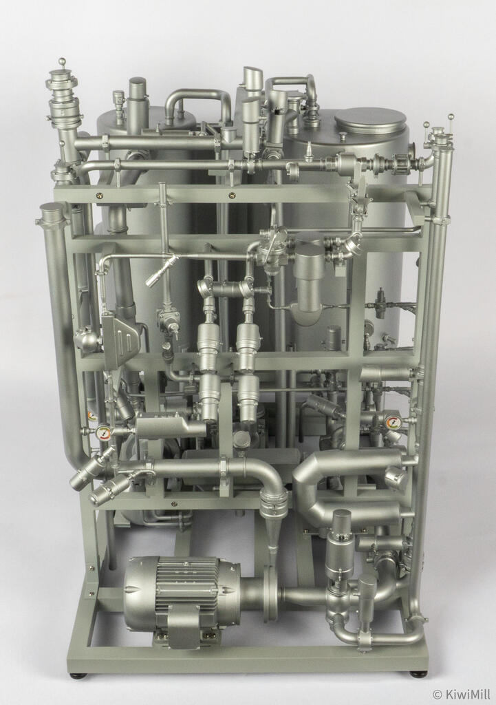 End view of the skid from above, showing the valve rack, angled actuators, upper manifold and front motor