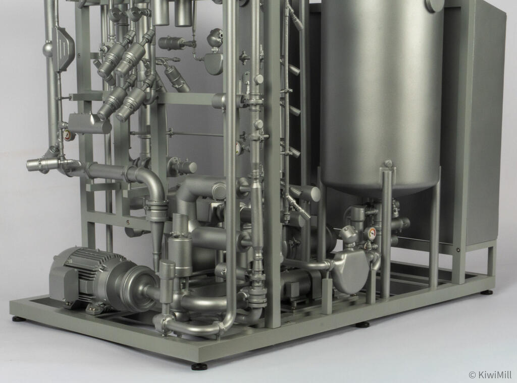 Close-up of the lower skid with finned motor and centrifugal pump, mass flow meter and cone-bottom tank legs